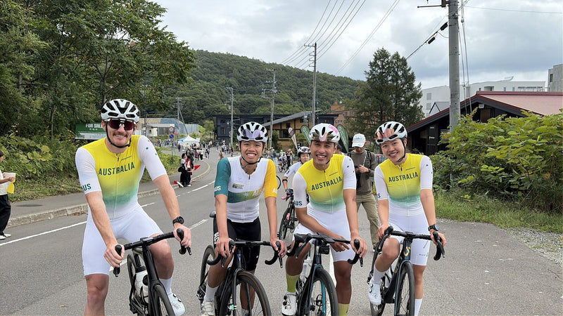 Tommy Egan and Sabrina Peng with Australian teammates in the SOOMOM Australia kit in Niseko before the 2026 UCI Gran Fondo World Championships