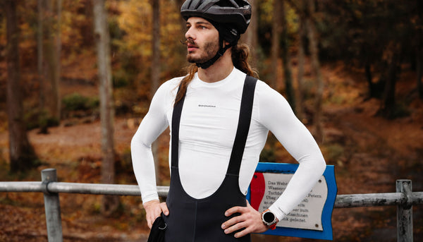 Male cyclist wearing a Soomom thermal base layer under bib straps on an autumn ride